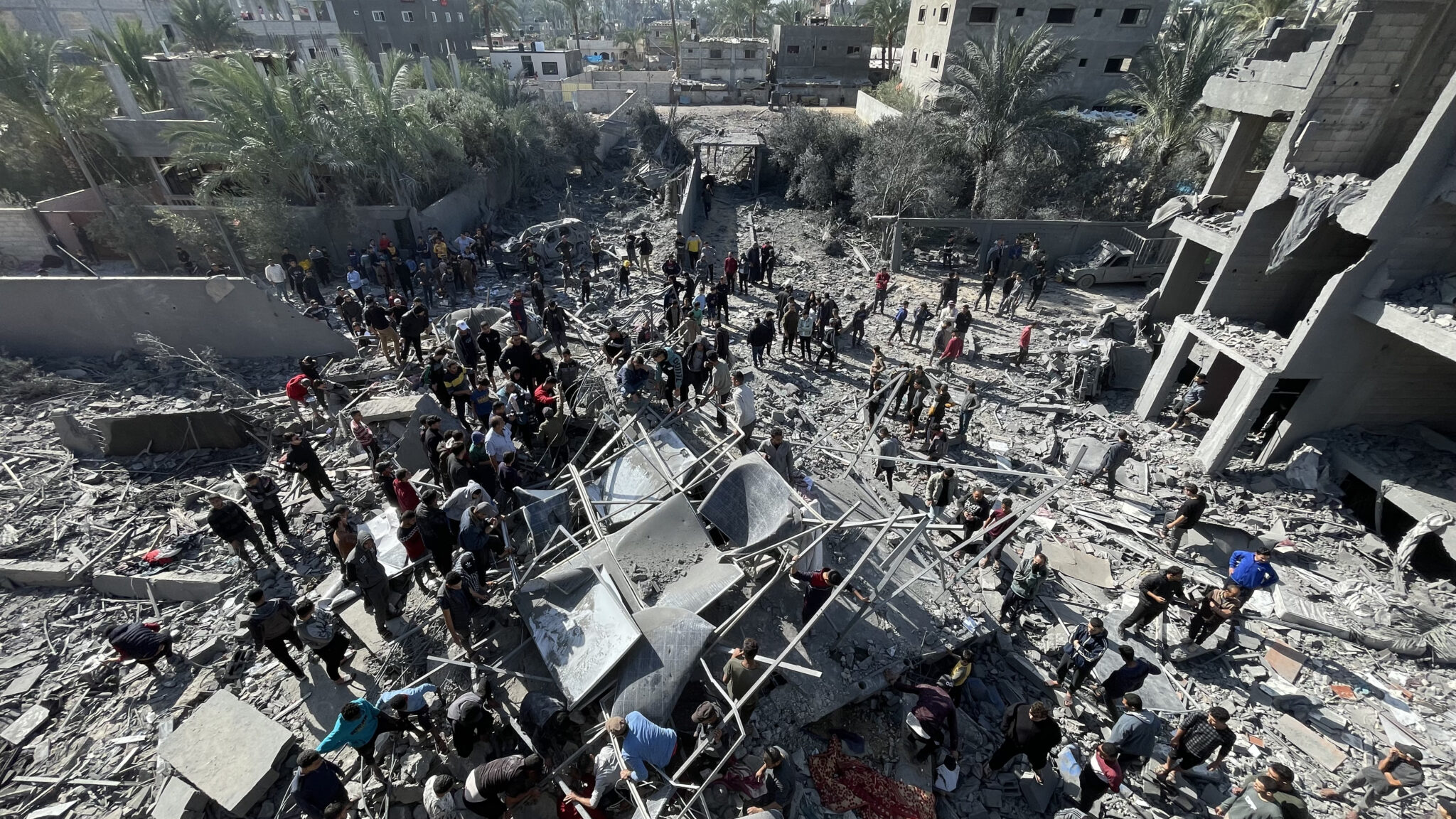 Civilians_from_Gaza_gathered_around_the_rubble_in_Gaza_war_23-25 <a href="https://commons.wikimedia.org/wiki/File:Civilians_from_Gaza_gathered_around_the_rubble_in_Gaza_war_23-25.jpg">Civilians from Gaza gathered around the rubble in Gaza war 23-25
</a> by Jaber Jehad Badwan, used under Creative Commons Attribution-Share Alike 4.0 International.