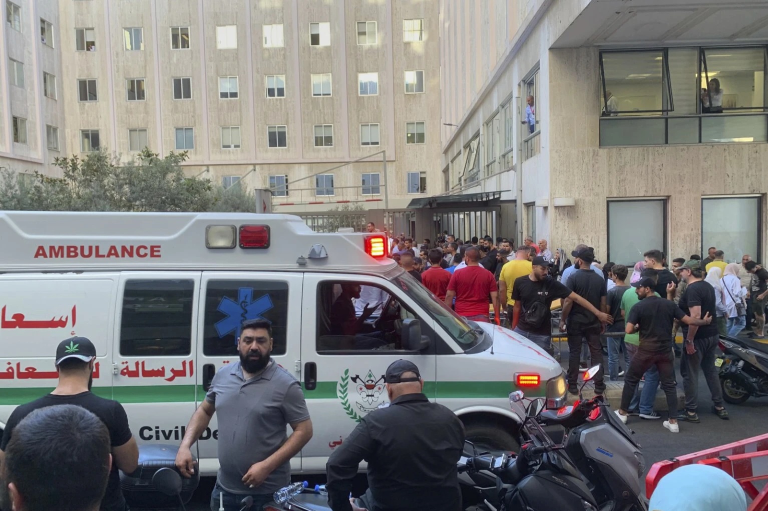 People gather outside the American University hospital in Beirut, Lebanon, Sept. 17, 2024. (AP Photo/Bassam Masri)
