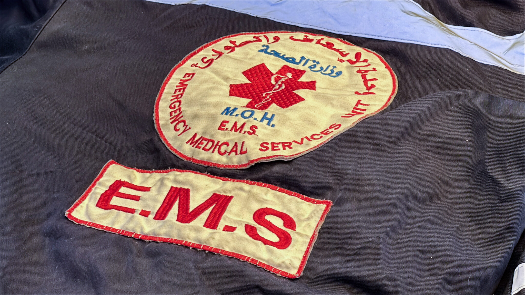 The jacket of paramedic Maysara al-Khawaja lies across his body after he was killed in an Israeli airstrike, al-Nasser Hospital, Khan Yunis, Gaza Strip, 22 June 2026. Photo: Doaa Albaz.
